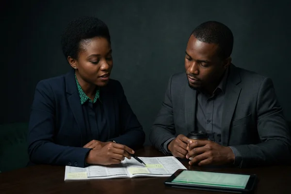 Account manager reviewing listing corrections with a client